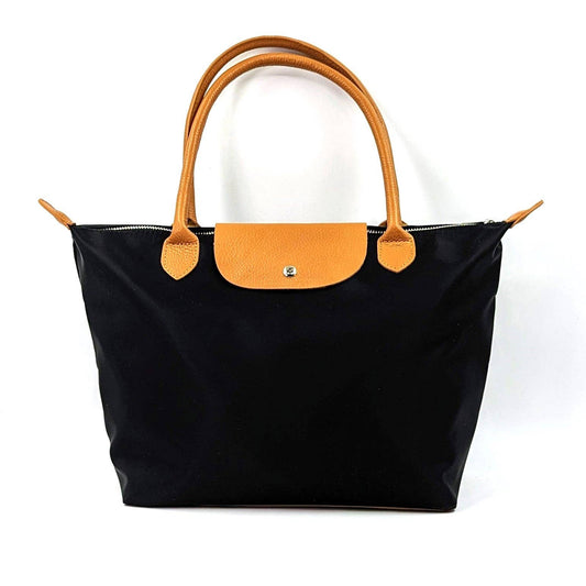 Inspired classic tote bag with water proof fabric body and leather handles and accessories